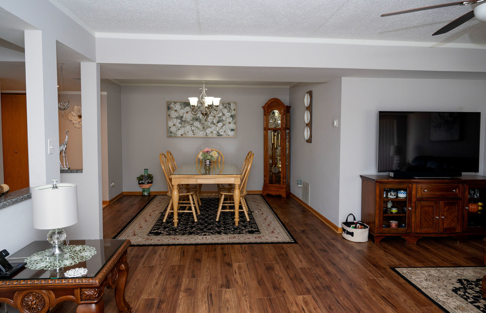 18124 Rita Road, Unit 2C Tinley Park, IL 60477 - Photo 7 of 23 a living room with furniture and a flat screen tv