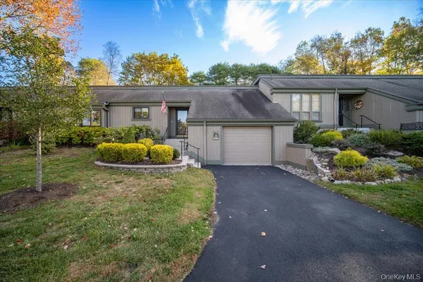 a house with trees in the background