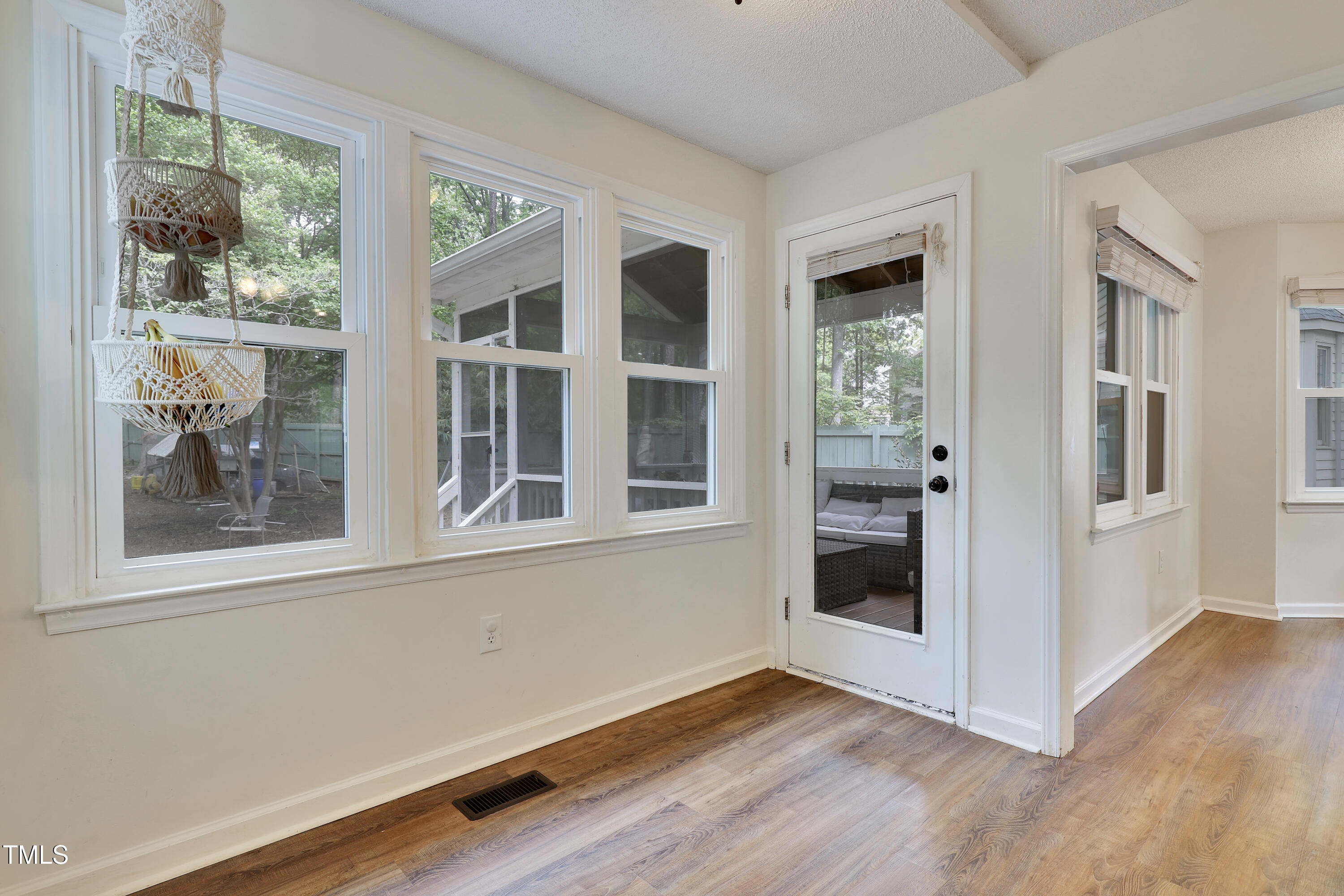 4711 Buttonbush Drive Durham, NC 27712 - Photo 15 of 43 a view of an entryway with wooden floor and windows