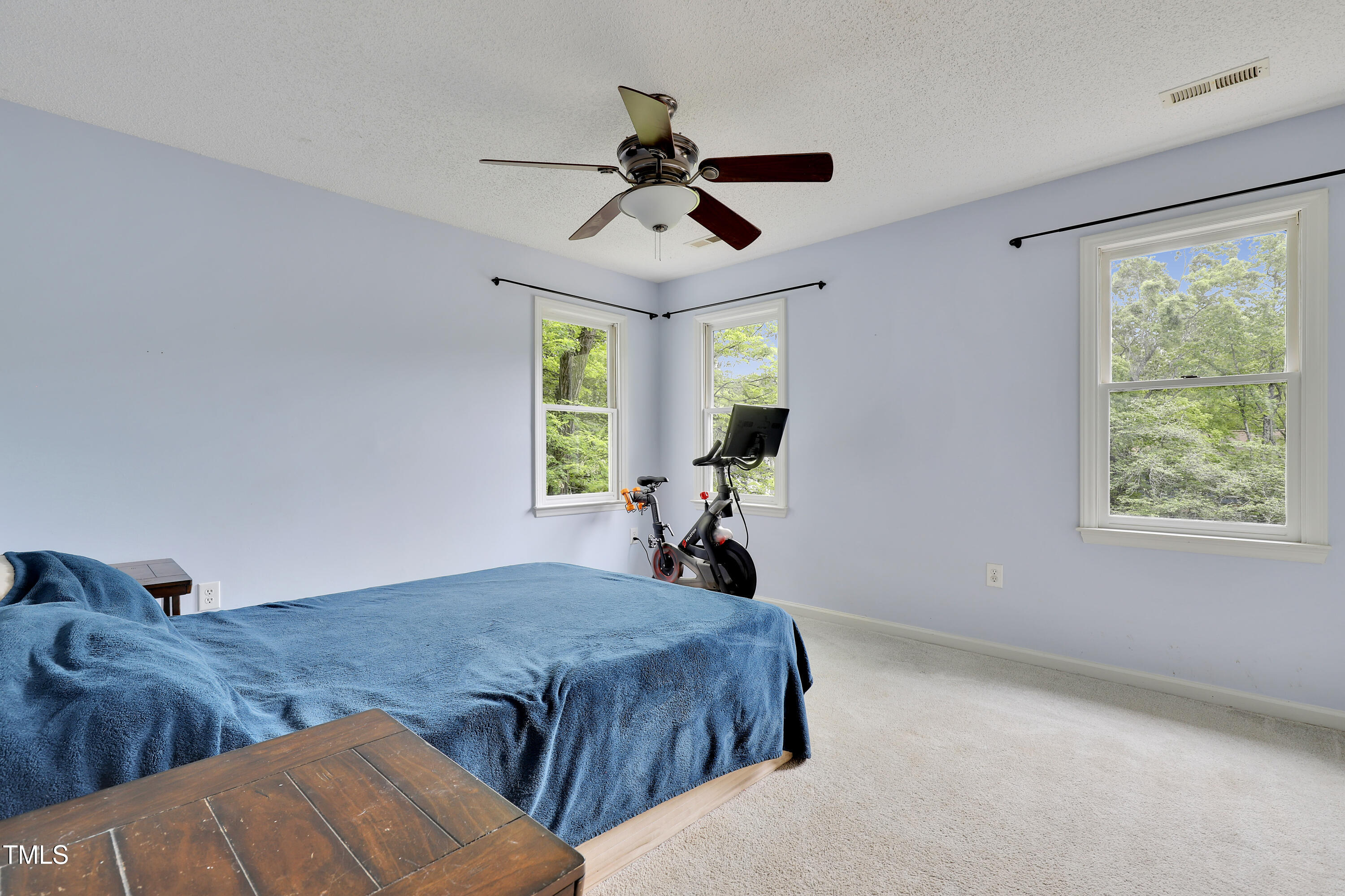 4711 Buttonbush Drive Durham, NC 27712 - Photo 17 of 43 a bed sitting in a room next to a window