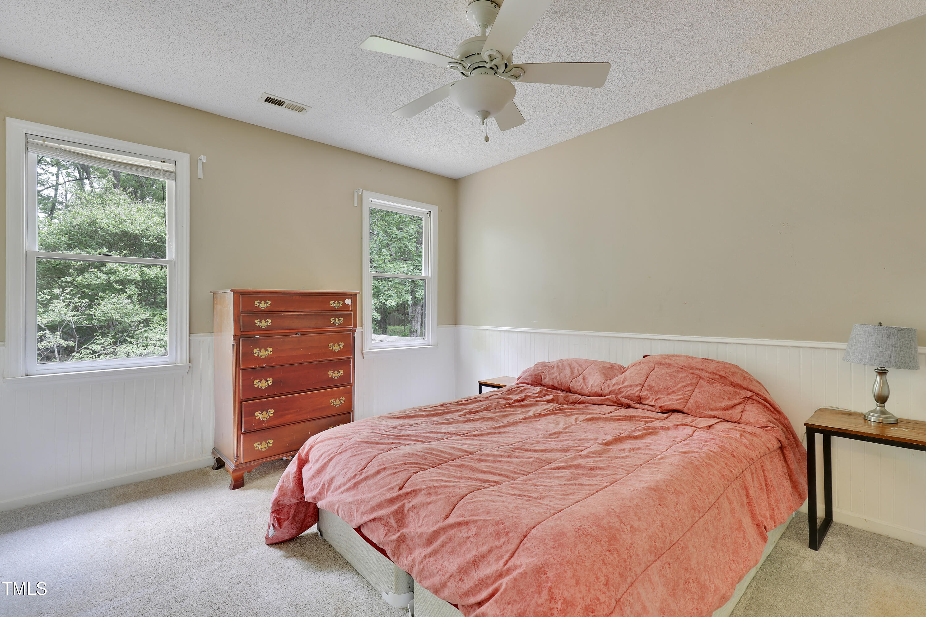 4711 Buttonbush Drive Durham, NC 27712 - Photo 19 of 43 a bedroom with a bed and a window