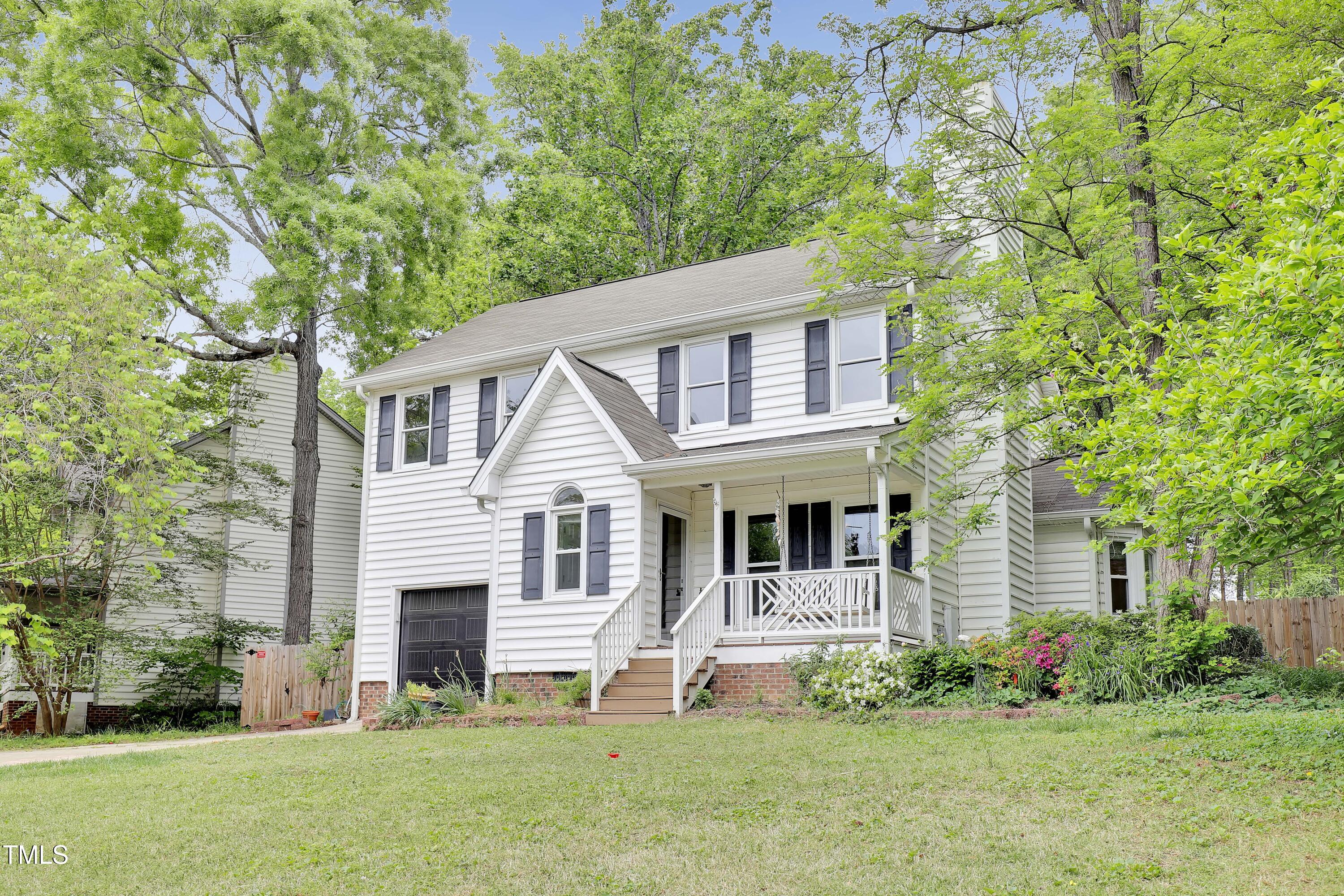 4711 Buttonbush Drive Durham, NC 27712 - Photo 2 of 43 a front view of a house with a yard and garage