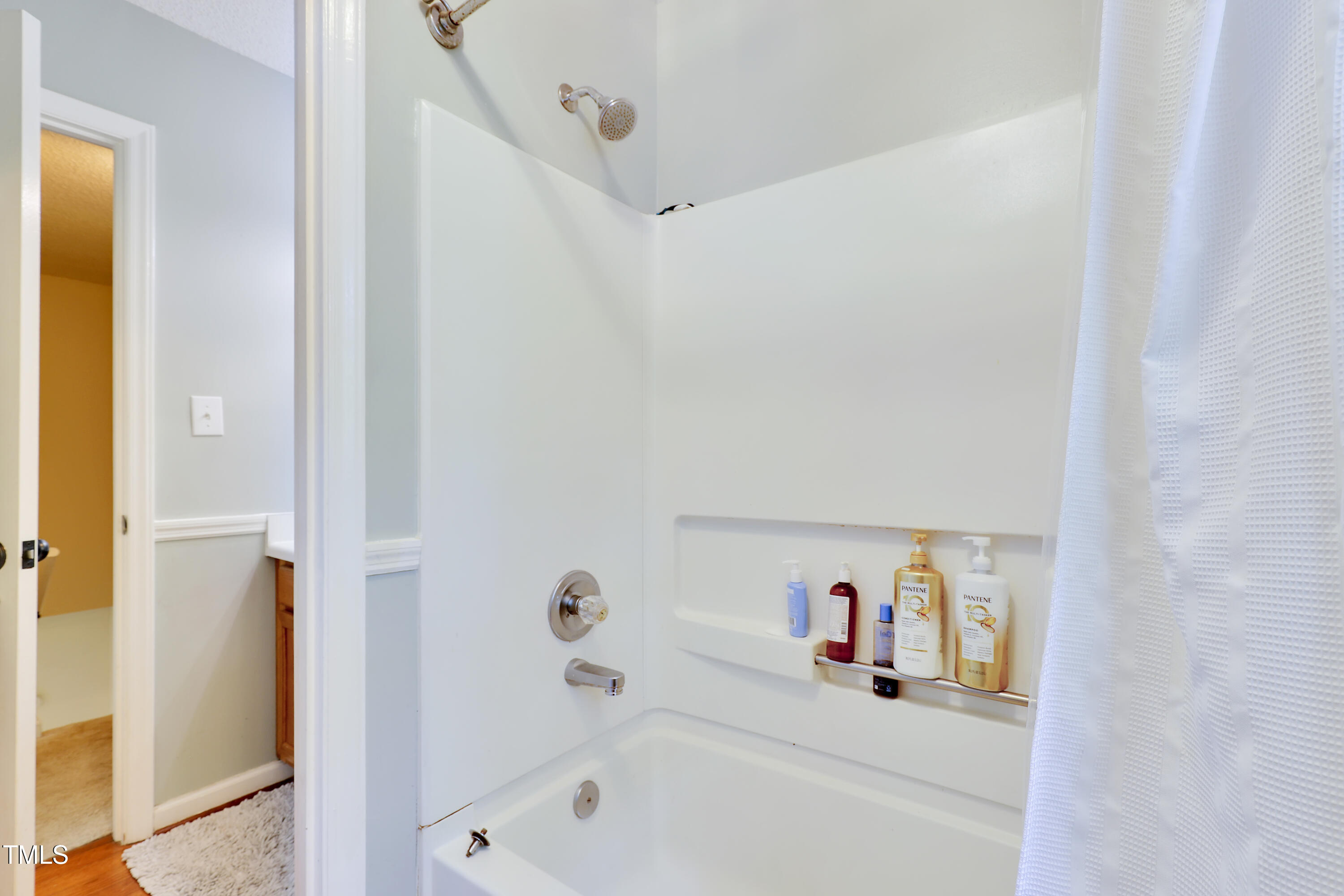 4711 Buttonbush Drive Durham, NC 27712 - Photo 22 of 43 a bathroom with a bathtub and a shower