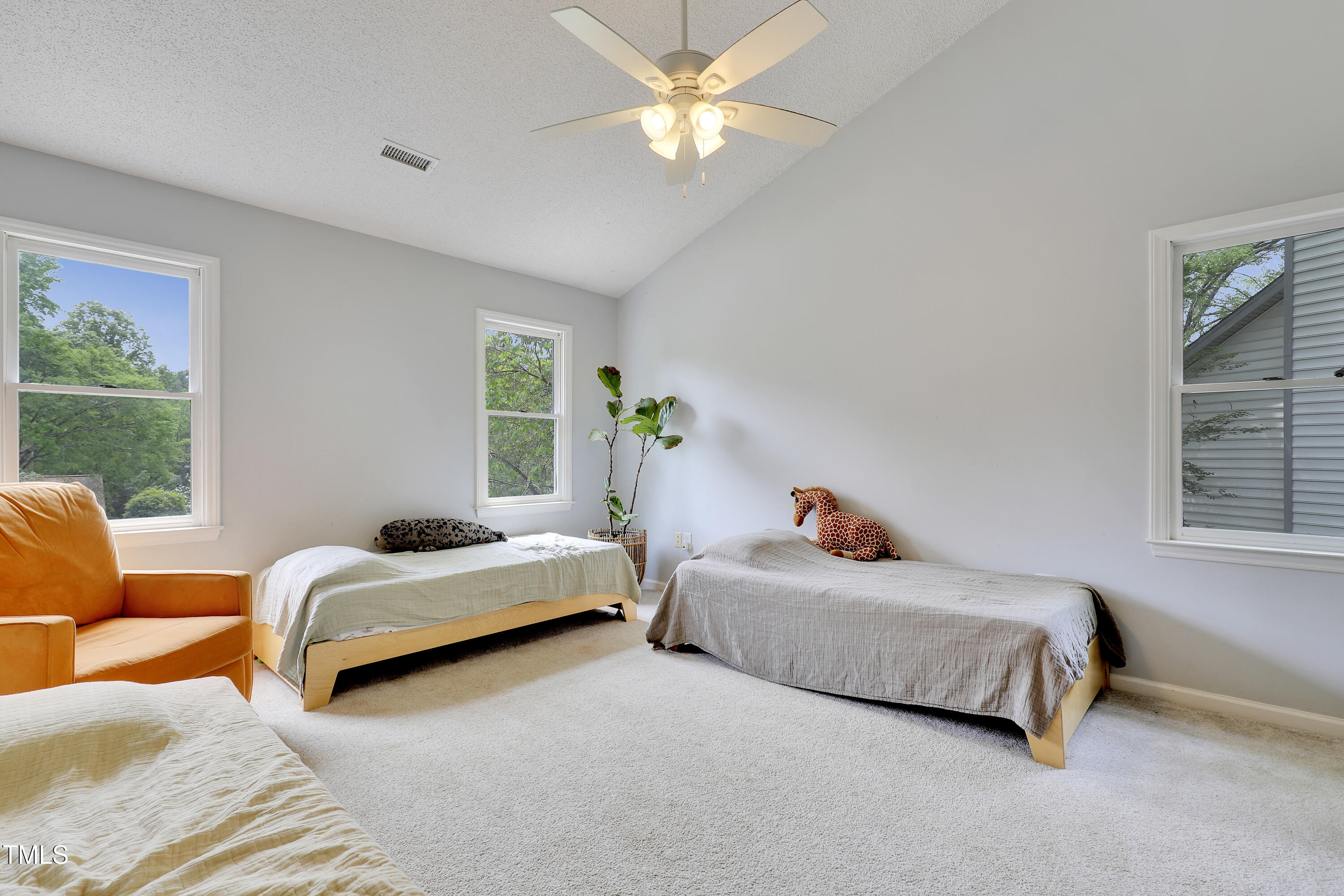 4711 Buttonbush Drive Durham, NC 27712 - Photo 23 of 43 a bedroom with two beds and a window