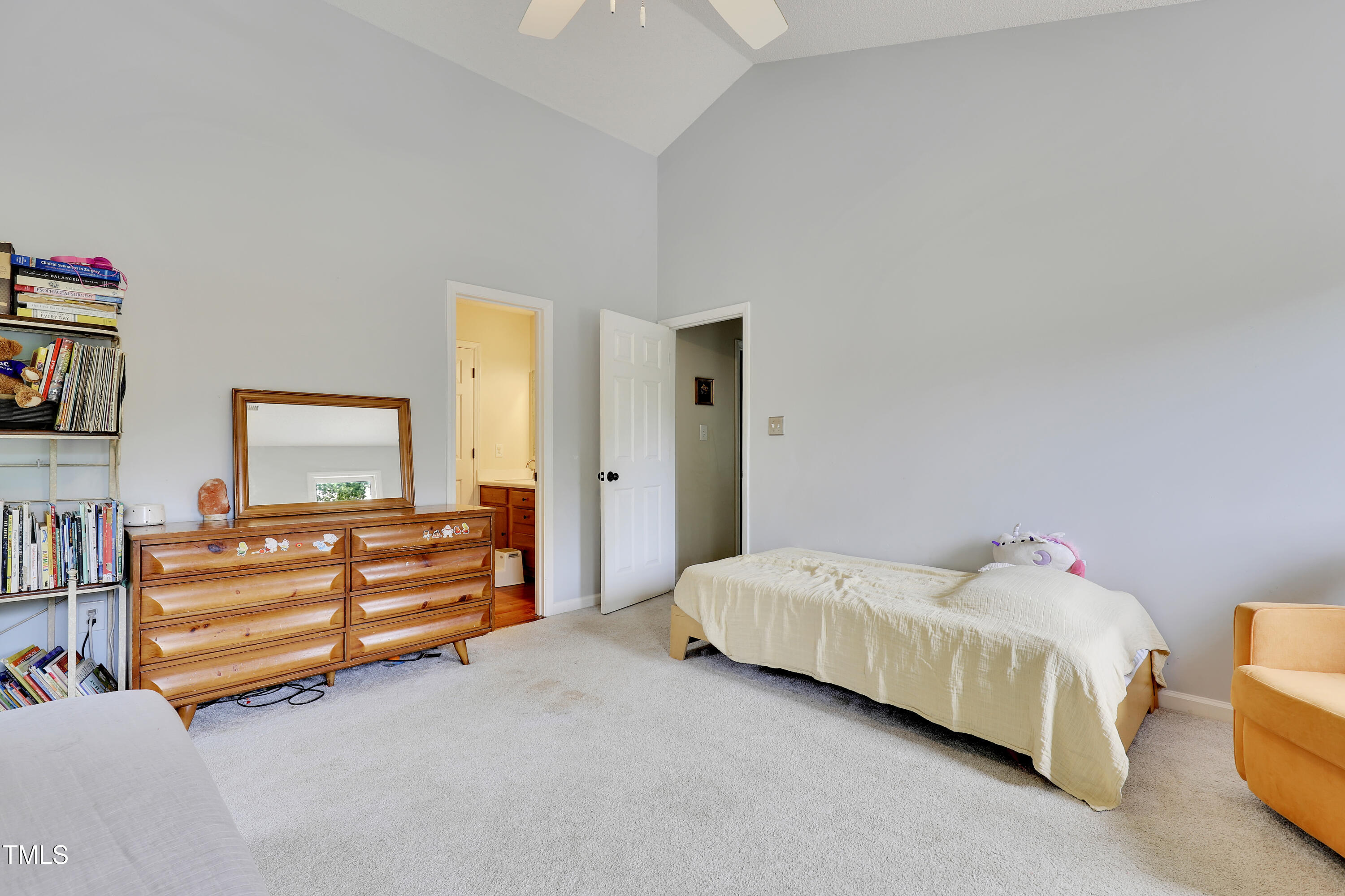 4711 Buttonbush Drive Durham, NC 27712 - Photo 24 of 43 a bedroom with a bed and a couch