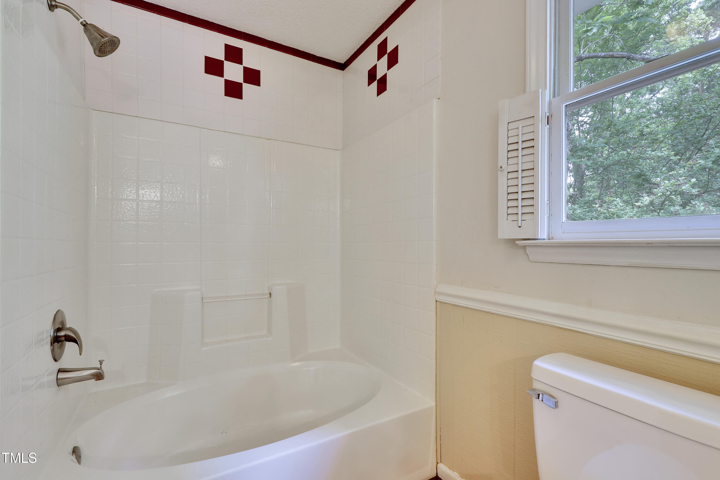 4711 Buttonbush Drive Durham, NC 27712 - Photo 26 of 43 a bathroom with a bathtub and a shower