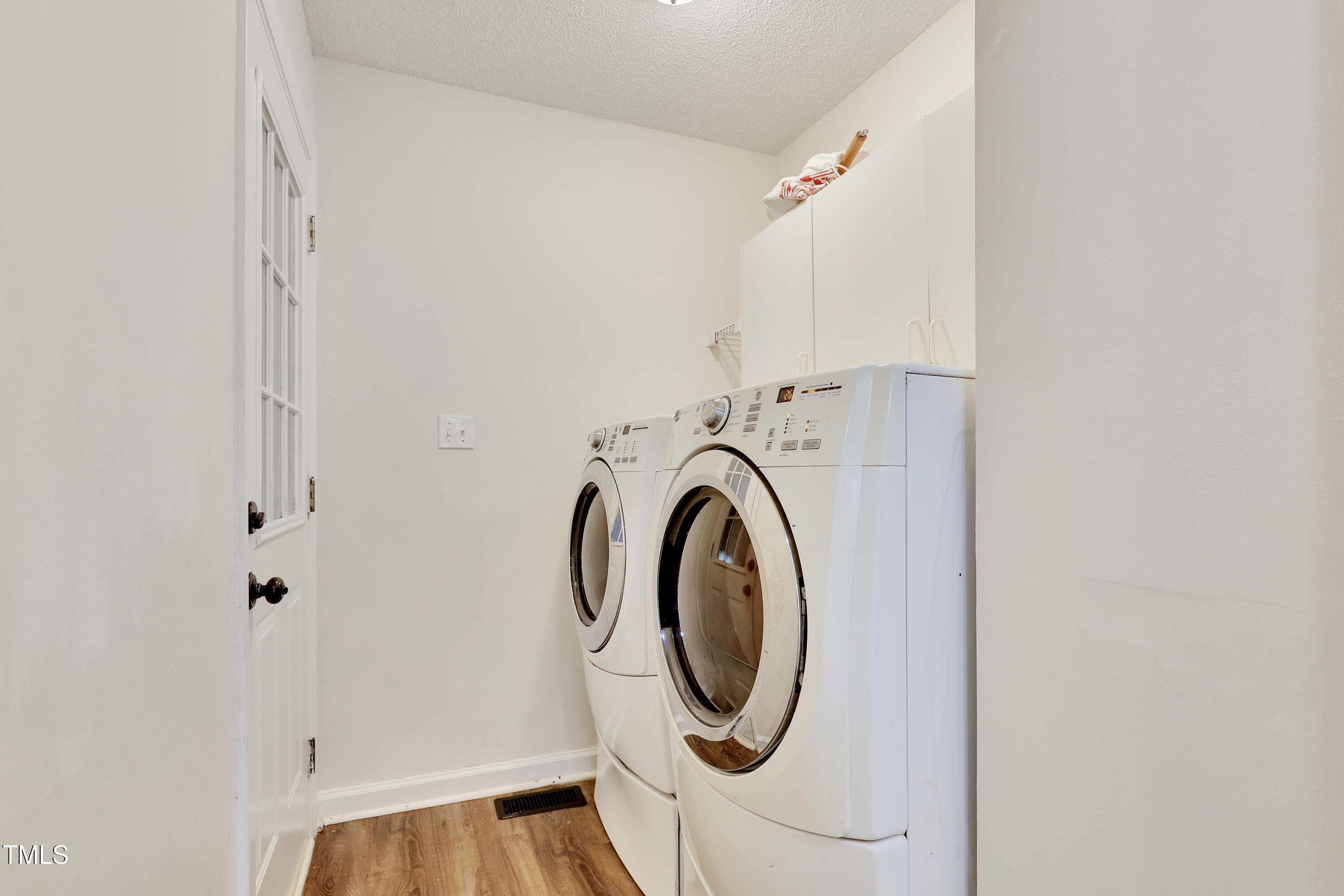 4711 Buttonbush Drive Durham, NC 27712 - Photo 28 of 43 a utility room with dryer and washer
