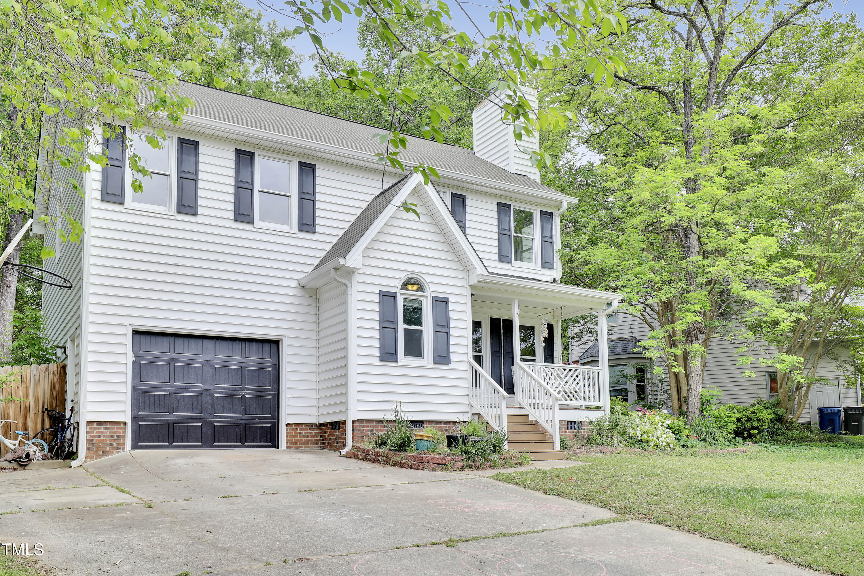 4711 Buttonbush Drive Durham, NC 27712 - Photo 3 of 43 a front view of a house with a yard and garage