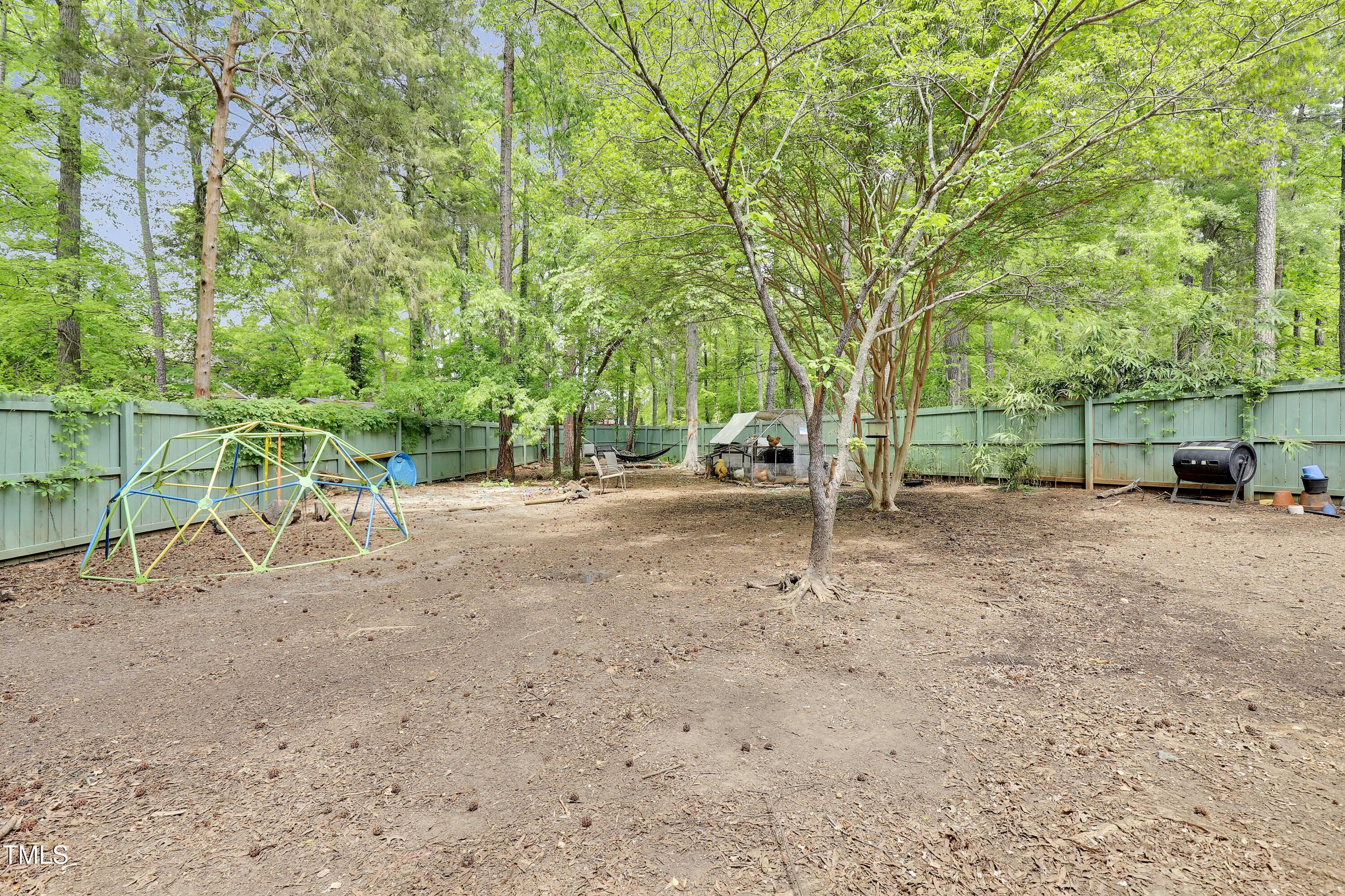4711 Buttonbush Drive Durham, NC 27712 - Photo 31 of 43 a view of outdoor space with deck and trees