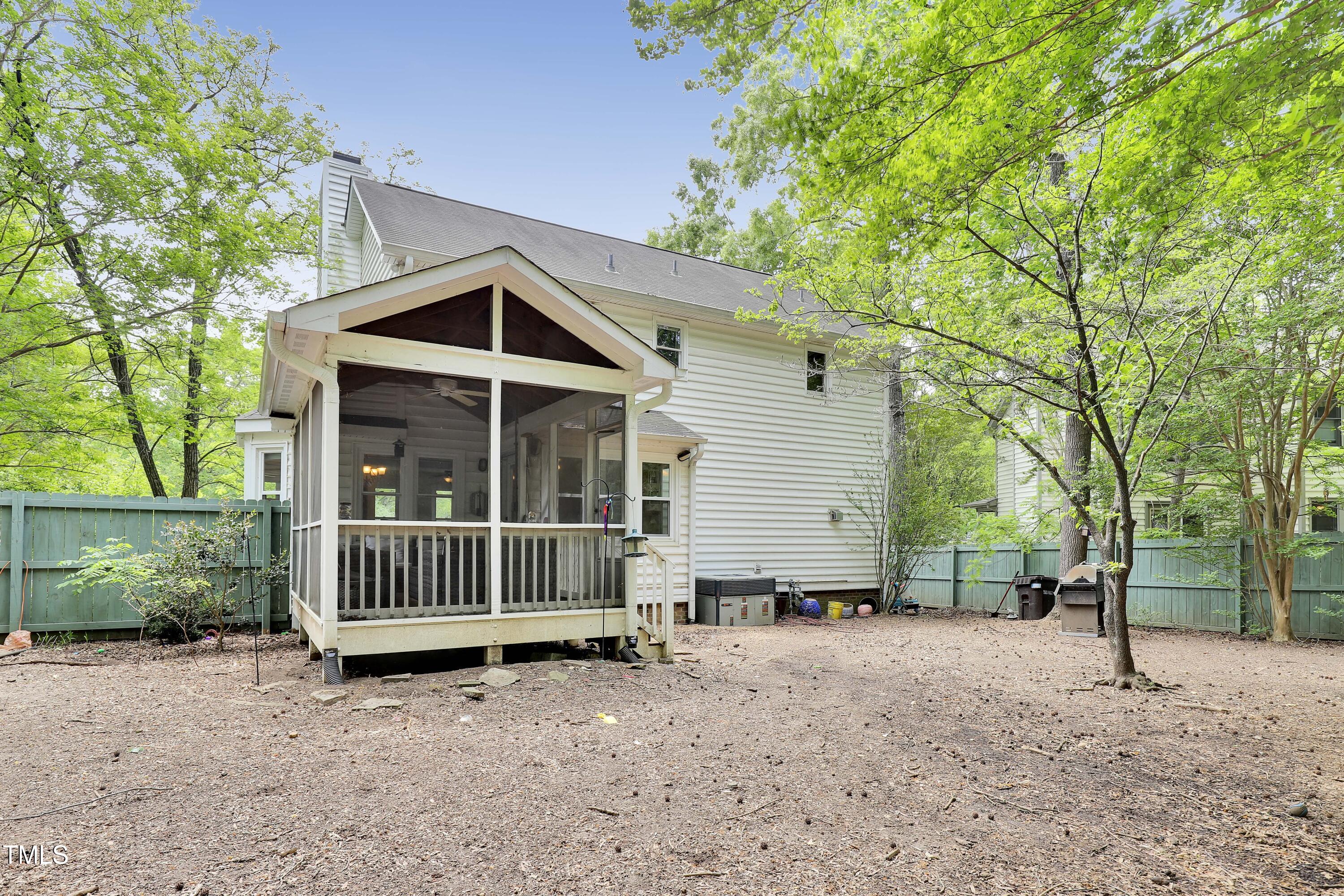 4711 Buttonbush Drive Durham, NC 27712 - Photo 33 of 43 a front view of a house with garden