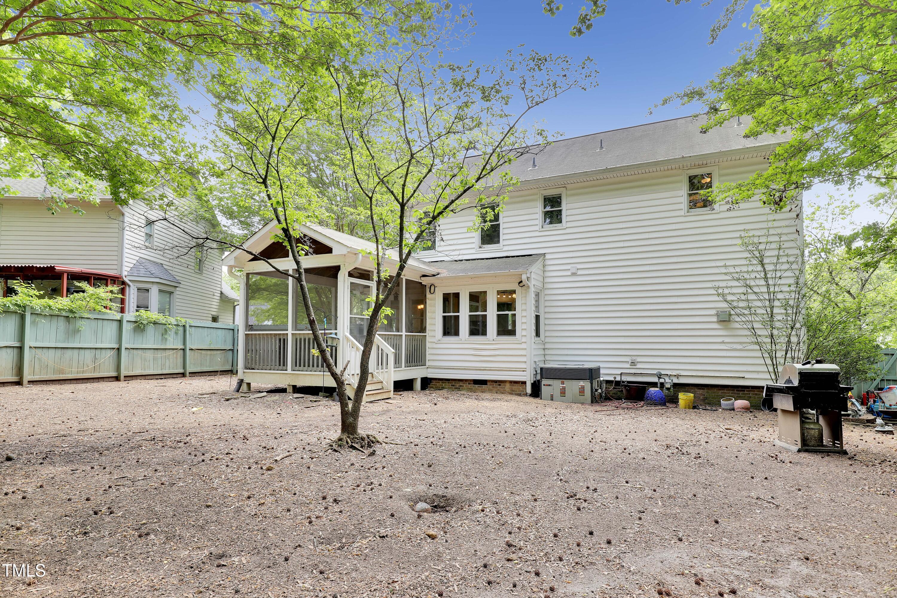 4711 Buttonbush Drive Durham, NC 27712 - Photo 34 of 43 a view of a house with backyard and a tree