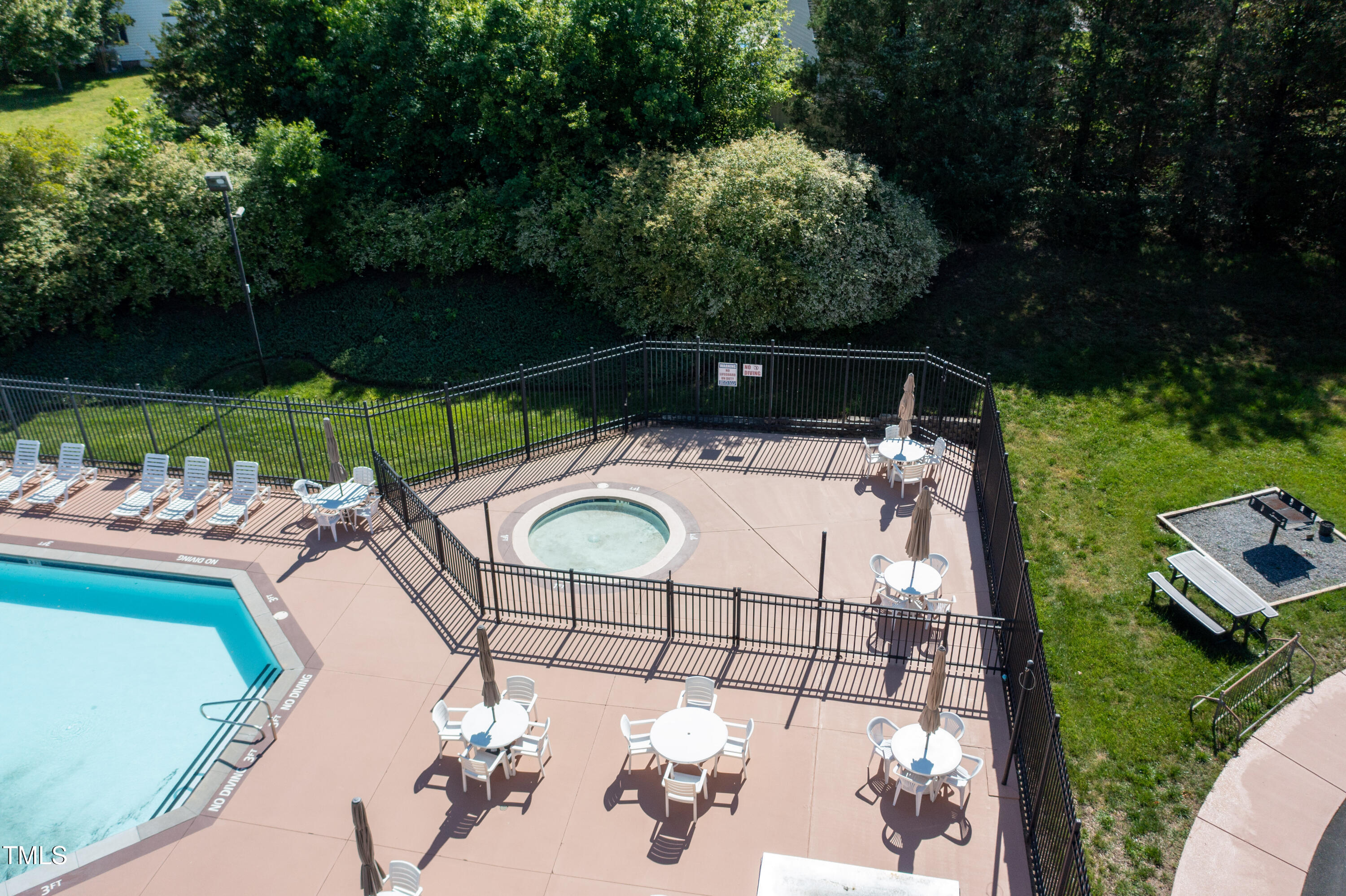 4711 Buttonbush Drive Durham, NC 27712 - Photo 41 of 43 a view of backyard with swimming pool and outdoor seating