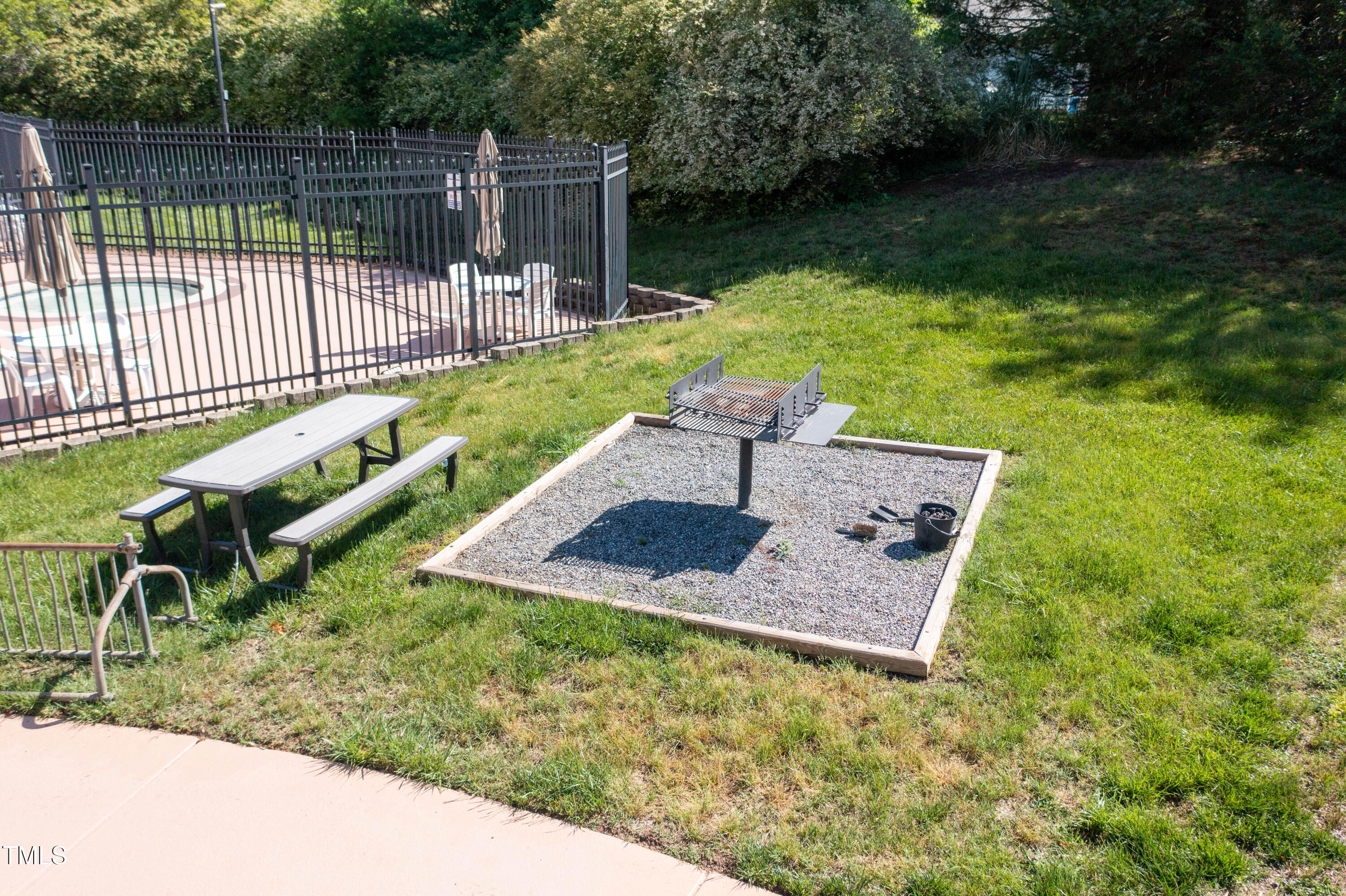4711 Buttonbush Drive Durham, NC 27712 - Photo 42 of 43 a view of a garden with wooden deck