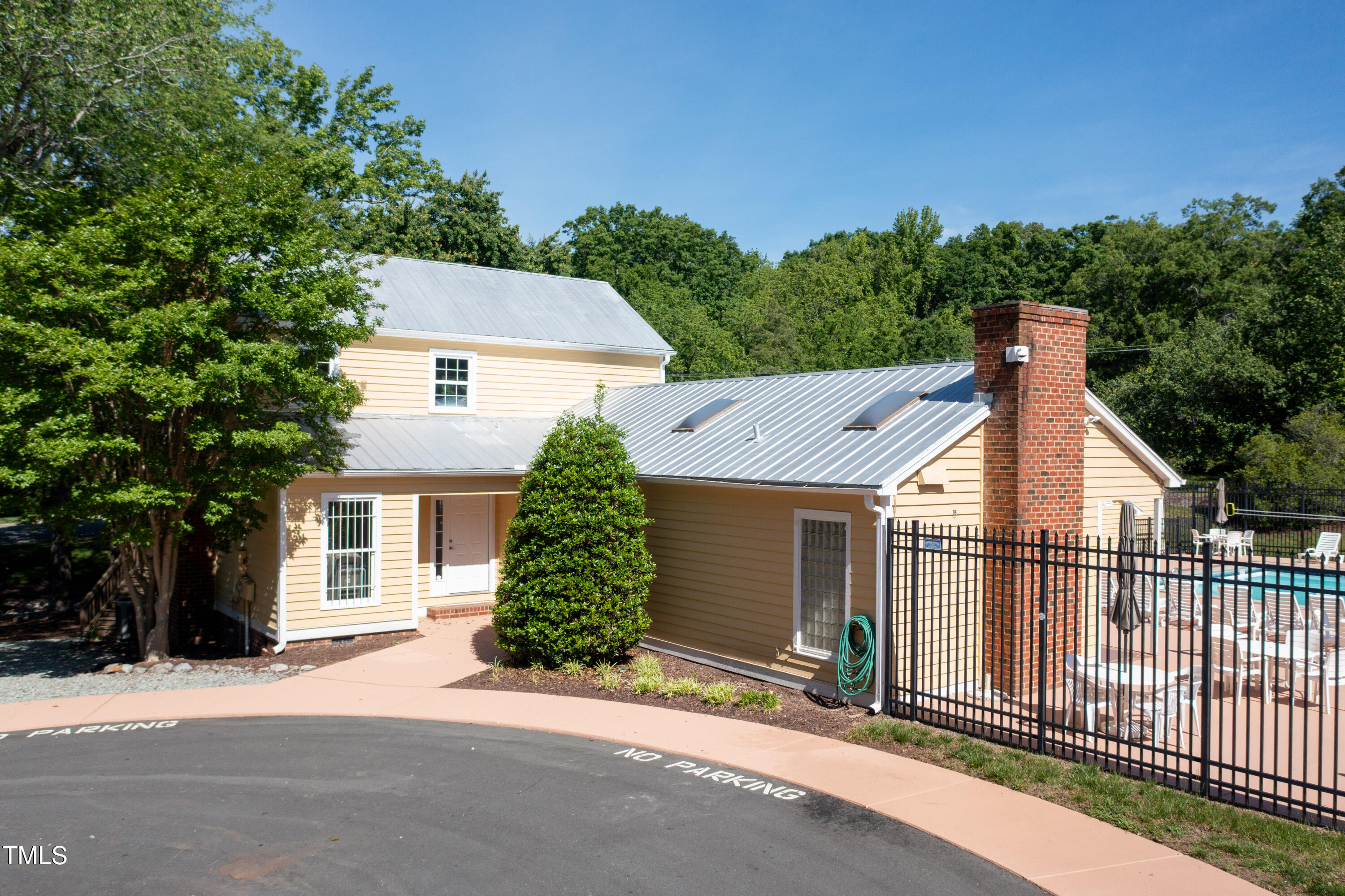 4711 Buttonbush Drive Durham, NC 27712 - Photo 43 of 43 a view of a house with a yard and potted plants