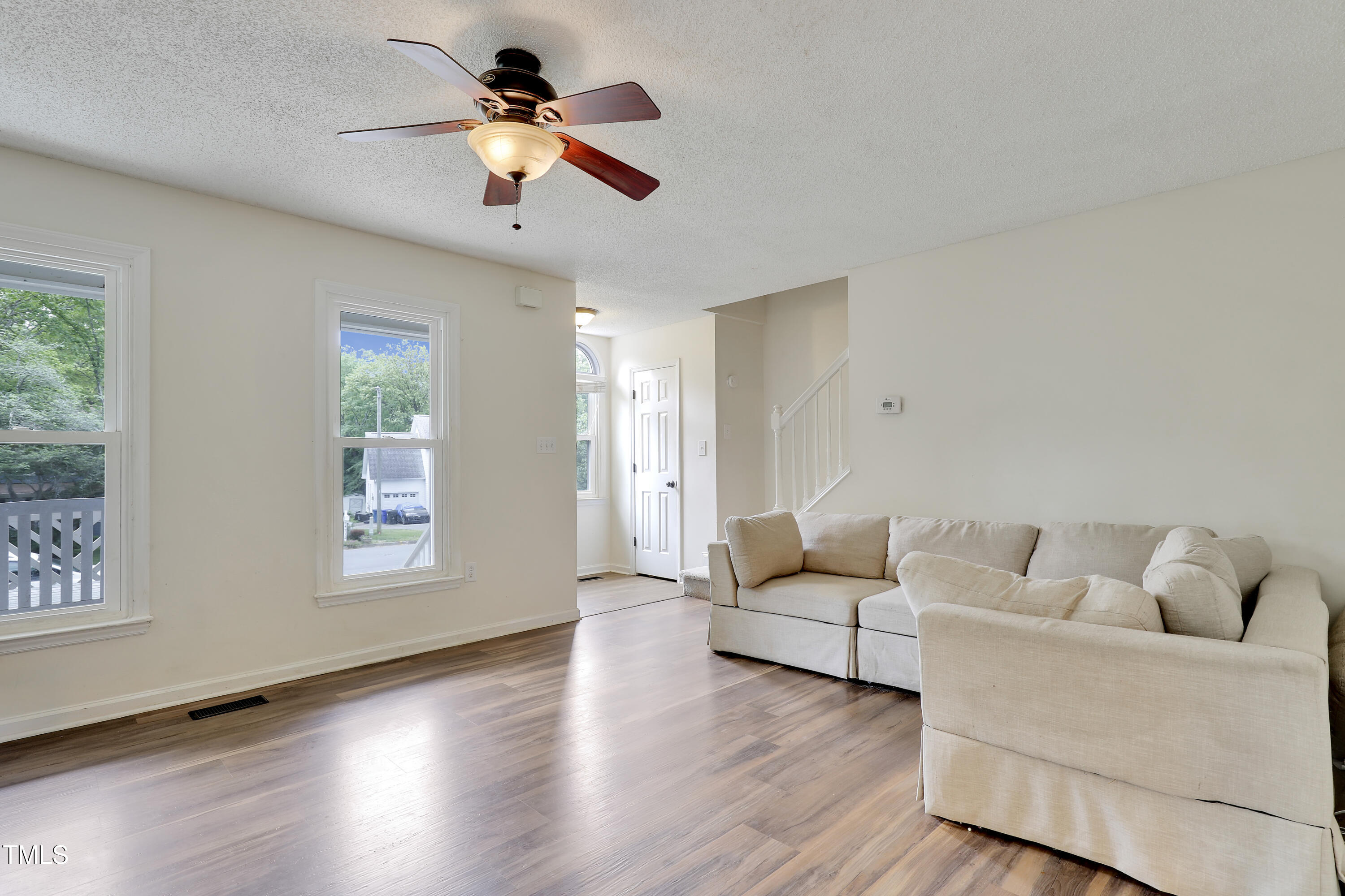 4711 Buttonbush Drive Durham, NC 27712 - Photo 7 of 43 a living room with furniture and a large window