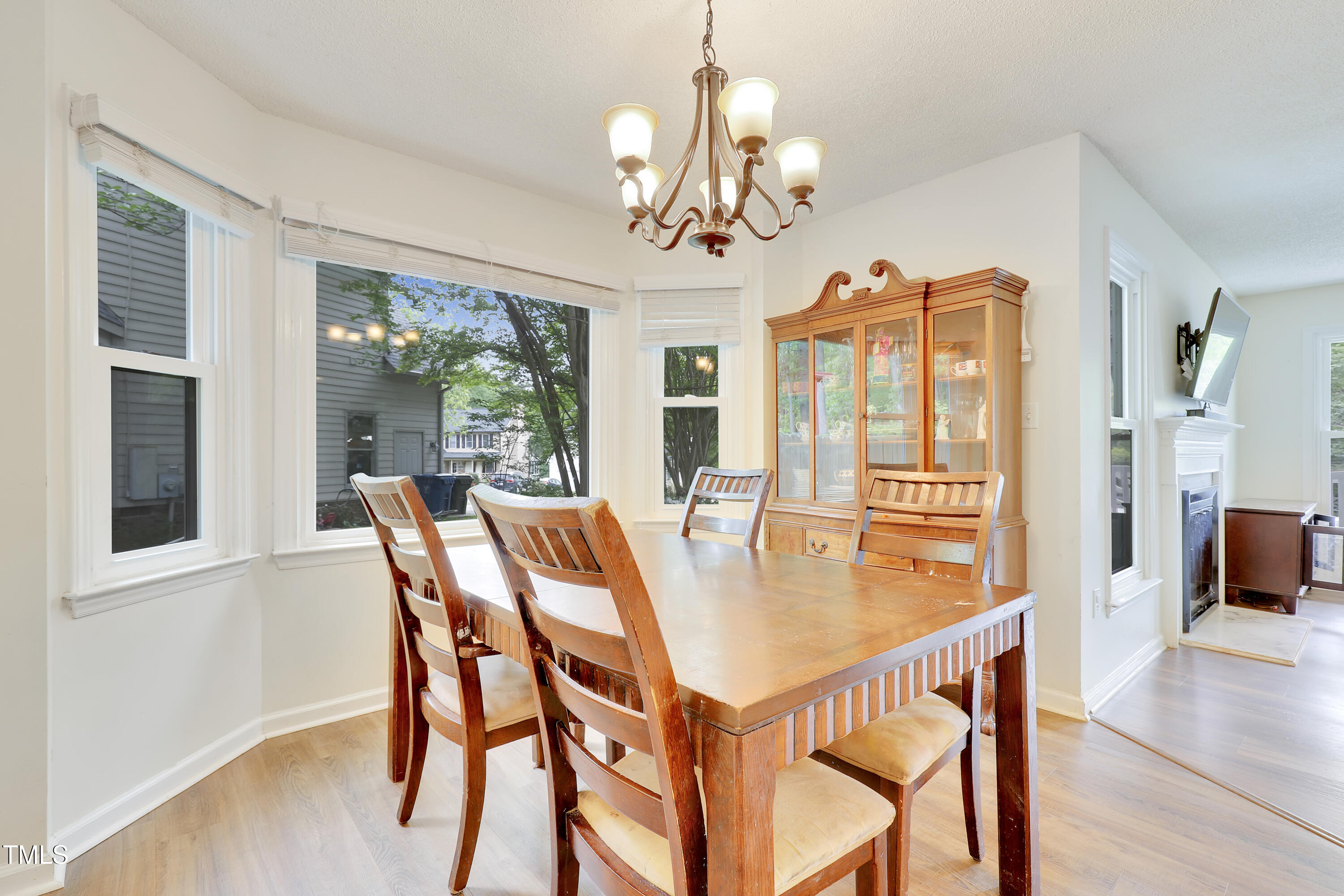 4711 Buttonbush Drive Durham, NC 27712 - Photo 9 of 43 a view of a dining room with furniture window and wooden floor