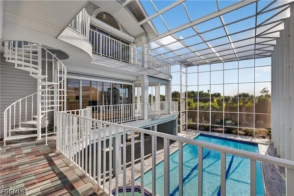 a view of a balcony with a ceiling fan