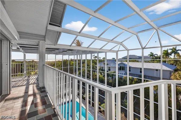 a view of balcony with wooden floor