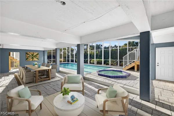 a view of a backyard with sitting area