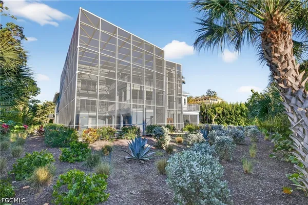 an aerial view of residential building and ocean