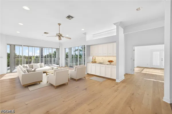 a kitchen with stainless steel appliances granite countertop a sink and cabinets