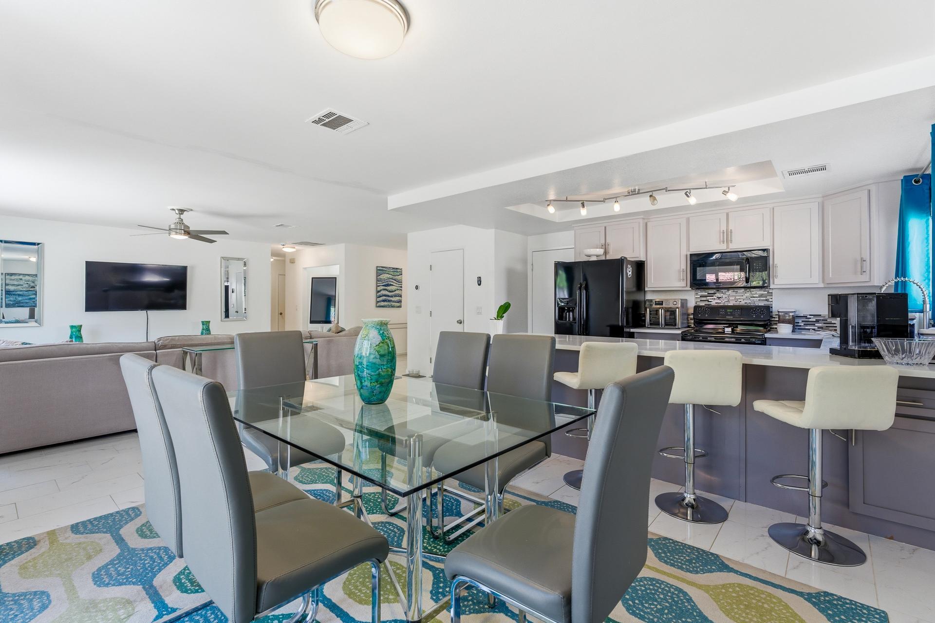 67220 Quijo Road Cathedral City, CA 92234 - Photo 7 of 26 a view of kitchen with dining table and chairs