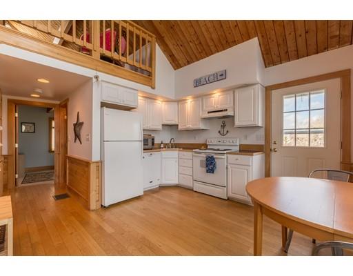24 Columbia Way Newbury, MA 01951 - Photo 11 of 30 a kitchen with white cabinets and white appliances