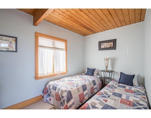 24 Columbia Way Newbury, MA 01951 - Photo 16 of 30 a bedroom with a bed and wooden floor