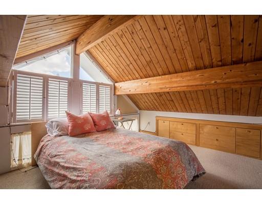 24 Columbia Way Newbury, MA 01951 - Photo 20 of 30 a bedroom with a bed and wooden floor