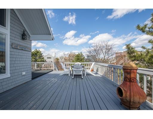 24 Columbia Way Newbury, MA 01951 - Photo 7 of 30 a view of a deck with wooden floor and seating space