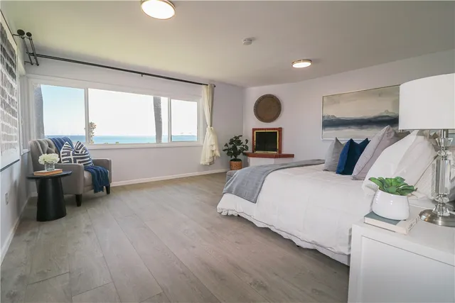 a spacious bedroom with a bed and window