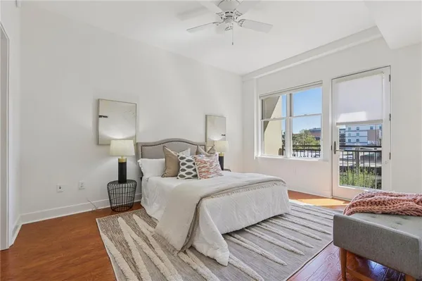 a bedroom with a bed and a mirror