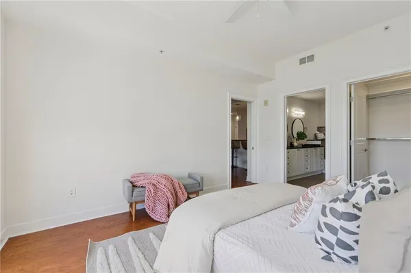a bedroom with a bed and a chair