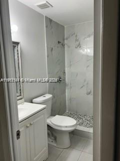 4972 Southwest 136th Place, Unit 4972 Miami, FL 33175 - Photo 11 of 24 a white toilet sitting next to a bathroom sink
