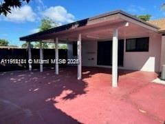 4972 Southwest 136th Place, Unit 4972 Miami, FL 33175 - Photo 21 of 24 a view of a house with a patio
