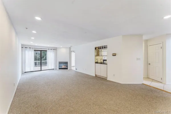 a view of a big room with windows and cabinet