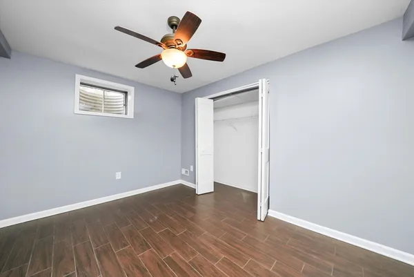 a view of an entryway with wooden floor