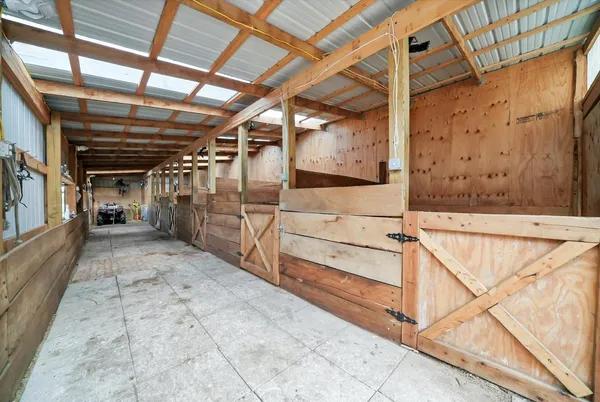 a view of empty room with wooden ceiling