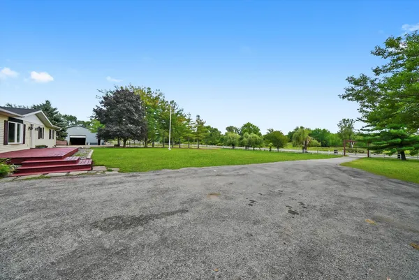 a view of house with outdoor space and tree s
