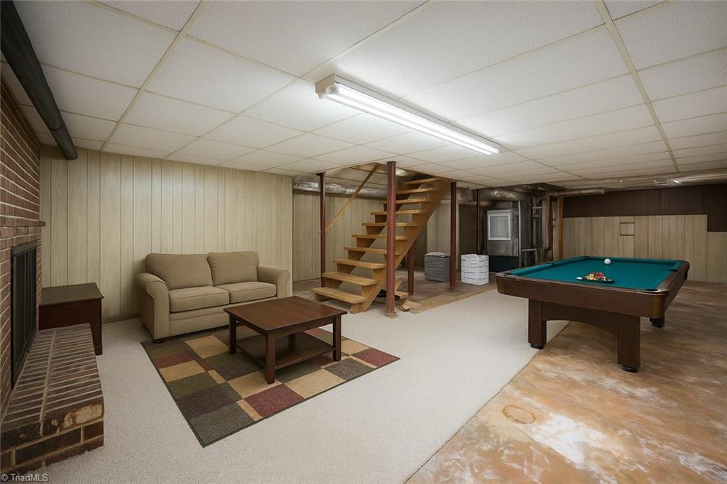 6350 Roscoe Road Denton, NC 27239 - Photo 26 of 50 Basement with fireplace- virtually staged