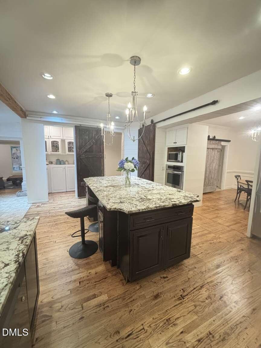 1204 Queensferry Road Cary, NC 27511 - Photo 15 of 50 a living room with granite countertop furniture rug and wooden floor