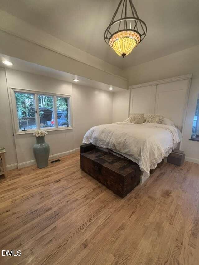 1204 Queensferry Road Cary, NC 27511 - Photo 17 of 50 a spacious bedroom with a bed and window