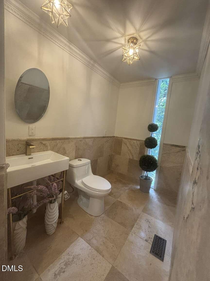 1204 Queensferry Road Cary, NC 27511 - Photo 20 of 50 a bathroom with a sink mirror and toilet