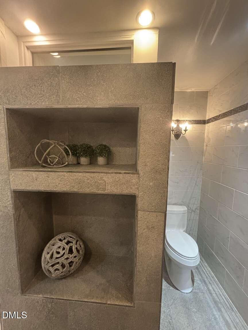 1204 Queensferry Road Cary, NC 27511 - Photo 21 of 50 a bathroom with a toilet and a sink