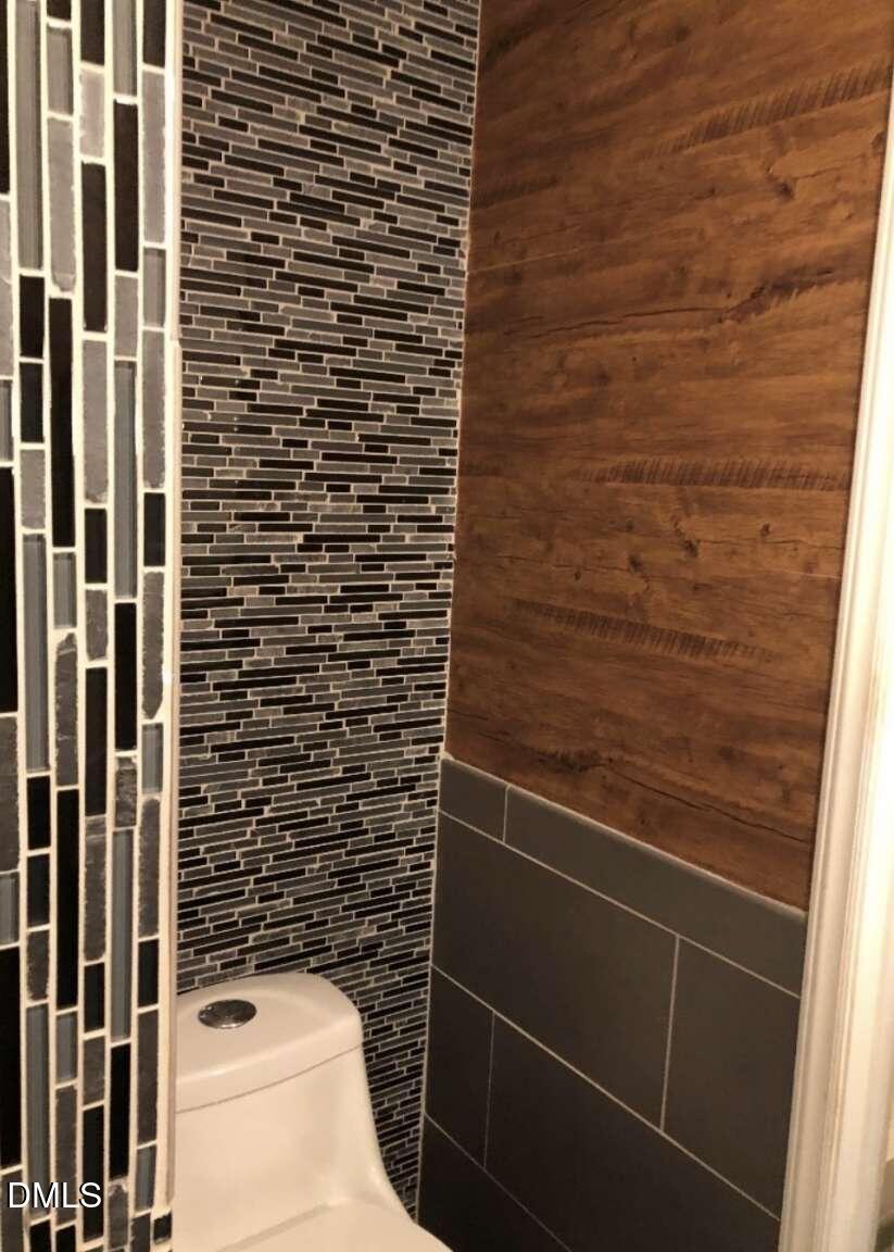 1204 Queensferry Road Cary, NC 27511 - Photo 22 of 50 a bathroom with a shower and a sink