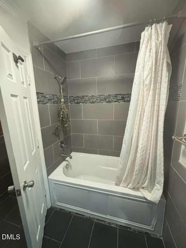 1204 Queensferry Road Cary, NC 27511 - Photo 25 of 50 a bathroom with a bathtub and a shower