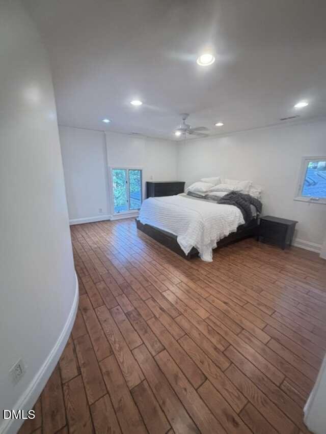 1204 Queensferry Road Cary, NC 27511 - Photo 27 of 50 a spacious bedroom with a bed and a night stand