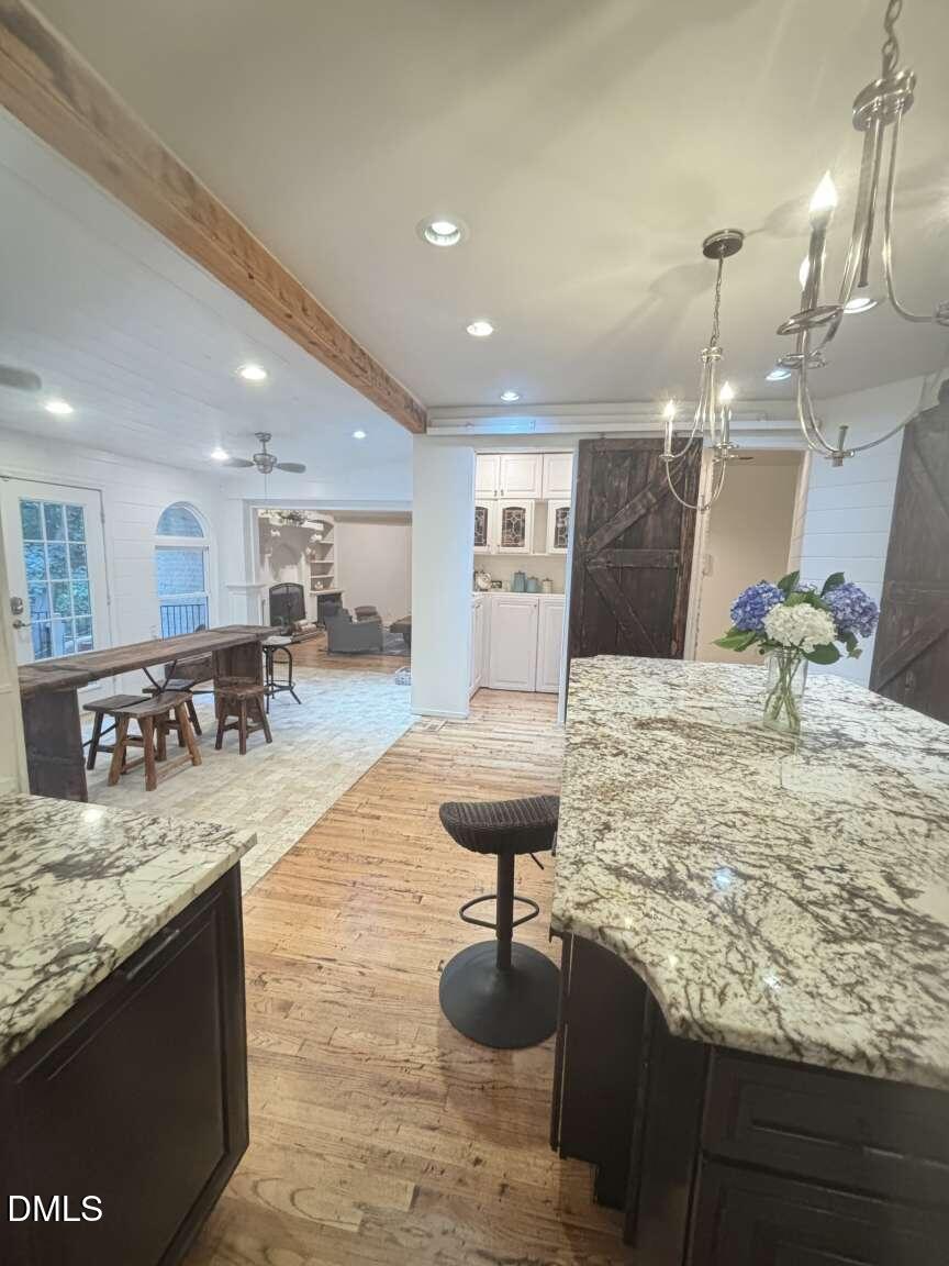 1204 Queensferry Road Cary, NC 27511 - Photo 28 of 50 a large kitchen with a table and chairs