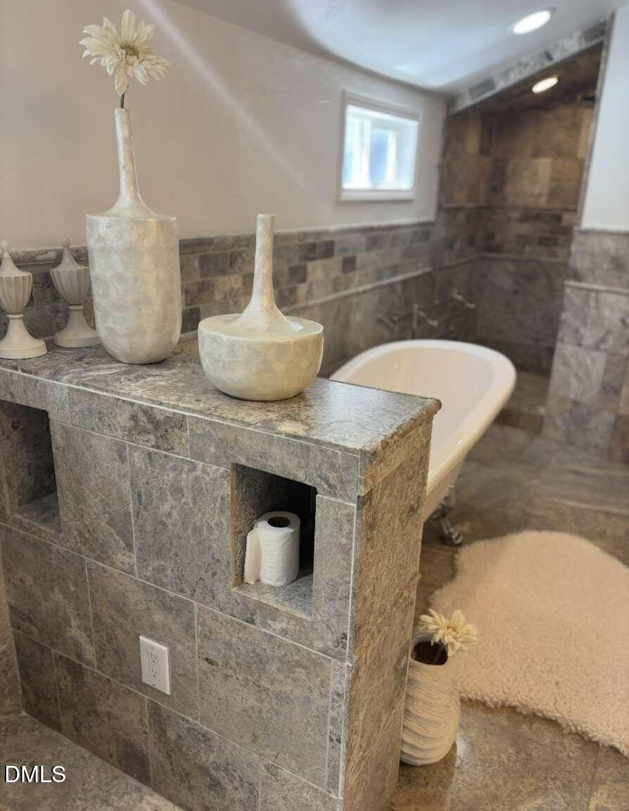 1204 Queensferry Road Cary, NC 27511 - Photo 39 of 50 a bathroom with a granite countertop sink a toilet and bathtub