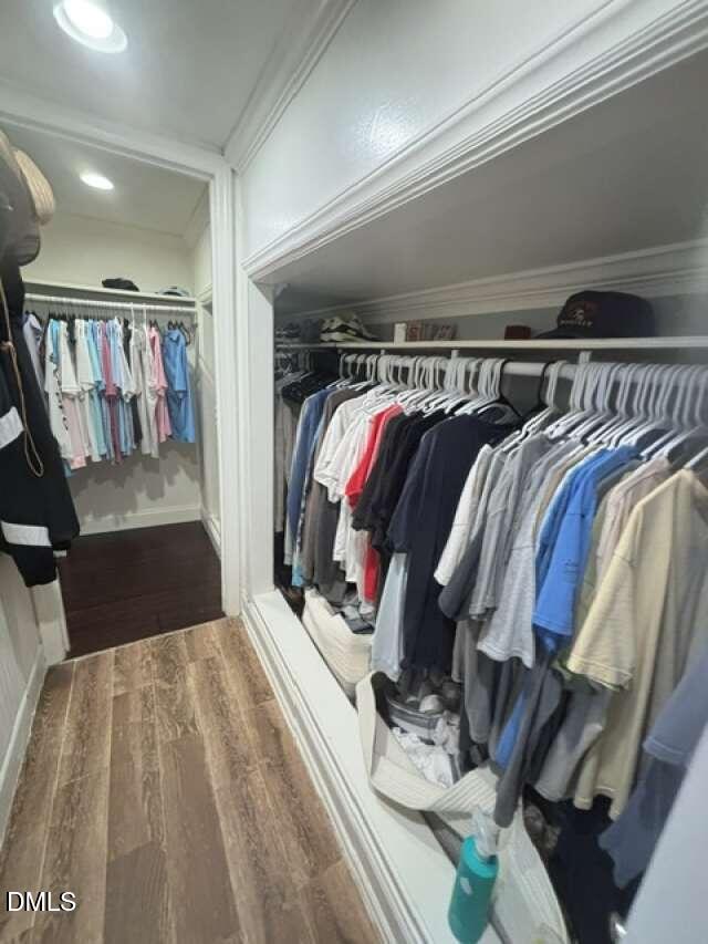 1204 Queensferry Road Cary, NC 27511 - Photo 42 of 50 a view of walk in closet with clothes and shoes